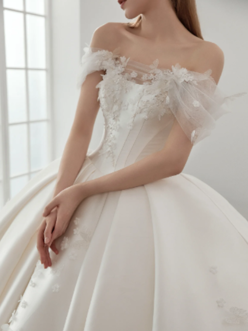 Detail of a Knightly bridal gown with floral embroidery
